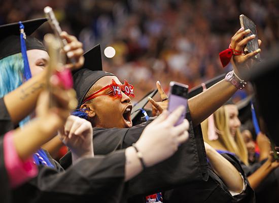 Graduates celebrating at 在线博彩's spring commencement